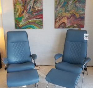 Two beautiful sparrow blue ekornes recliners.